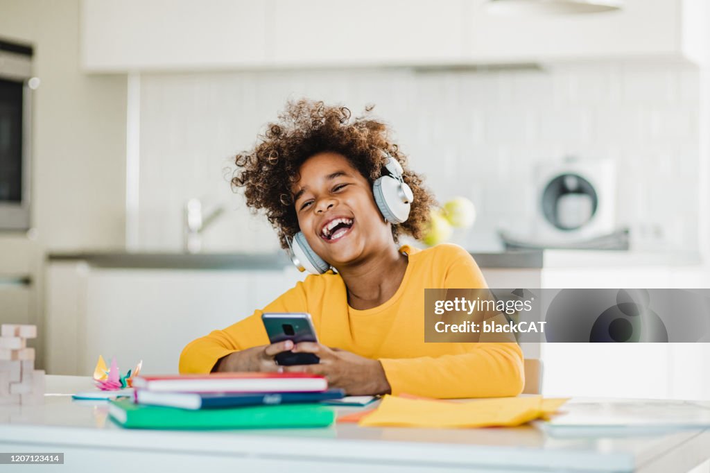 Young girl studying with smart phone