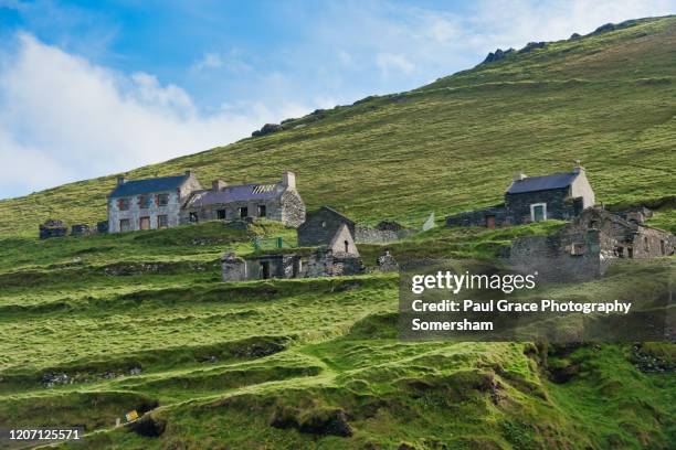 abandoned houses on great blasket island. ireland. - great blasket island stock-fotos und bilder