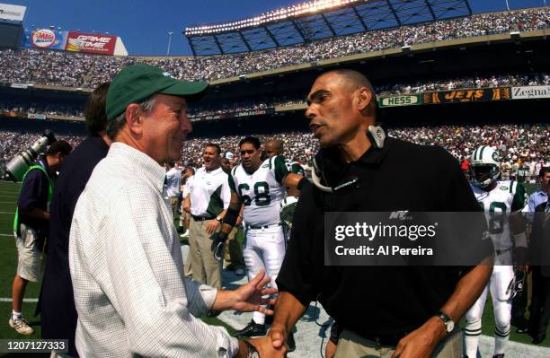 September 12: New York Mayor Michael Bloomberg meets with Head Coach of the New York Jets Herman Edwards when he participates in the Coin Toss before...
