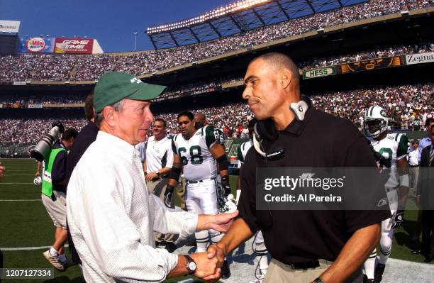 September 12: New York Mayor Michael Bloomberg meets with Head Coach of the New York Jets Herman Edwards when he participates in the Coin Toss before...