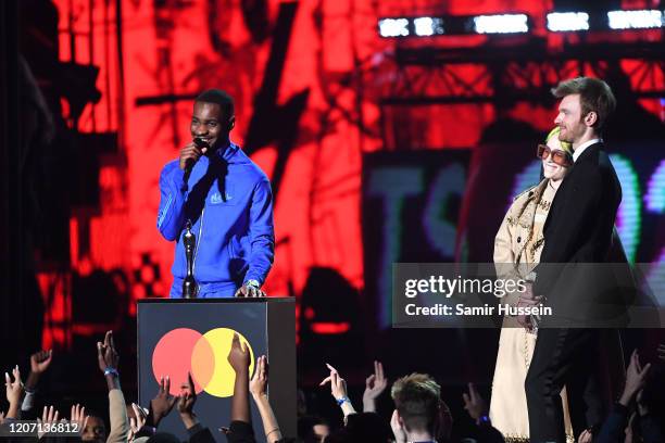 Dave accepts the Mastercard Album of The Year during The BRIT Awards 2020 at The O2 Arena on February 18, 2020 in London, England.