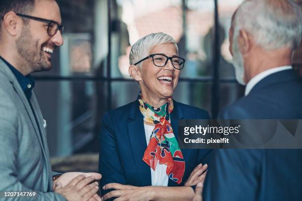 mature female business leader - short hair men stock pictures, royalty-free photos & images