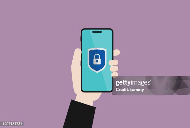 stockillustraties, clipart, cartoons en iconen met de zakenman houdt een mobiele telefoon met een beschermend schildteken - phishing