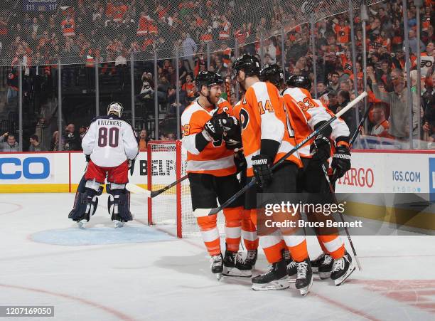 The Philadelphia Flyers celebrate a power-play goal by Jakub Voracek at 10:14 of the third period against the Columbus Blue Jackets as Claude Giroux...