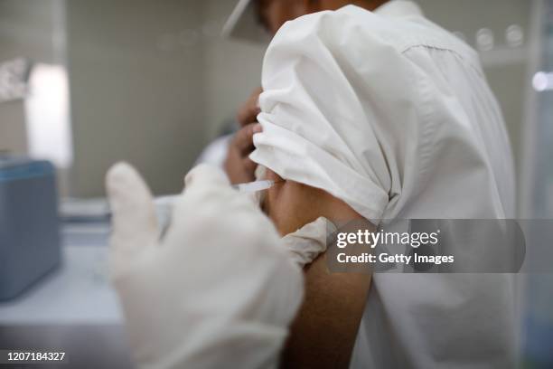 Person is vaccinated during a national campaign of vaccination implemented by the government after having decreed a state of health emergency at CDI...