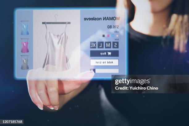 futuristic shopping of digital screen - women wearing see through clothing stockfoto's en -beelden