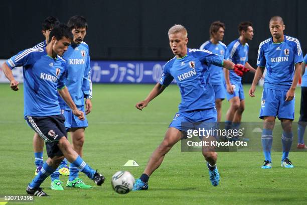 Yasuyuki Konno , Daisuke Matsui , Keisuke Honda and Takayuki Morimoto take part in the Japan national team training session ahead of the Kirin...