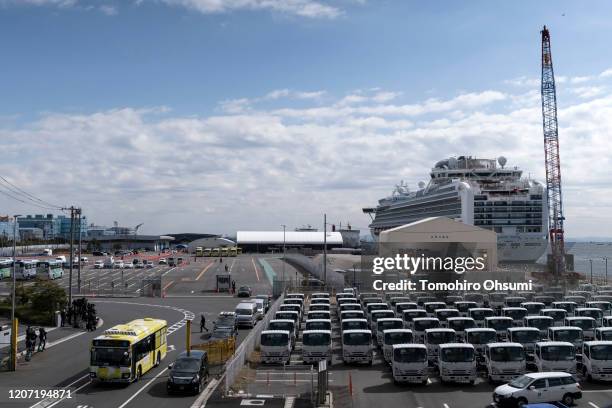 Bus carrying passengers who disembarked the quarantined Diamond Princess cruise ship leaves the Daikoku Pier on February 19, 2020 in Yokohama, Japan....