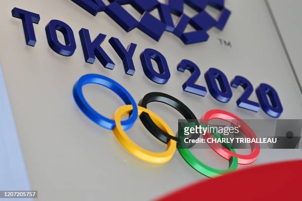 The logo for the Tokyo 2020 Olympic Games is seen in Tokyo on March 15, 2020.