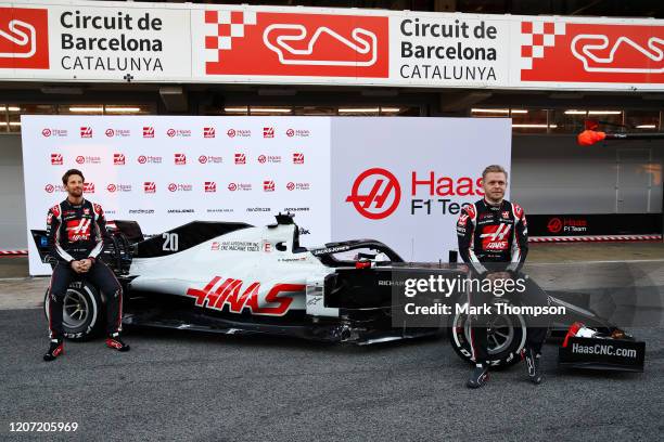 Romain Grosjean of France and Haas F1 and Kevin Magnussen of Denmark and Haas F1 are pictured at the roll out of the Haas F1 Team VF-20 Ferrari...