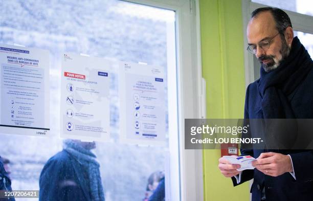 French Prime minister and candidate running as Le Havre's city mayor Edouard Philippe waits prior to casting his vote during the first round of...