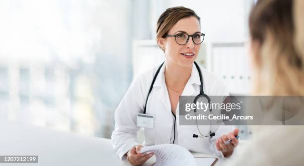 you're well on your way back to full health - female doctor stock pictures, royalty-free photos & images