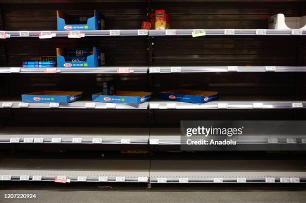 Supermarket shelves nearly empty without merchandise as people start to hoard goods following the coronavirus outbreak in Malakoff, Paris, France on...