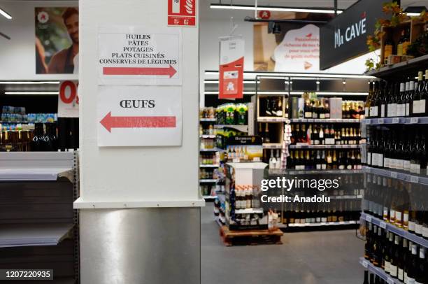 Supermarket shelves nearly empty without merchandise as people start to hoard goods following the coronavirus outbreak in Malakoff, Paris, France on...