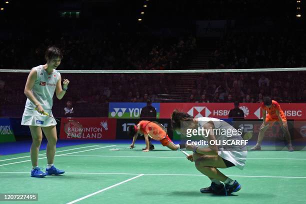 Japan's Yuki Fukushima and Sayaka Hirota celebrate their win over China's Du Yue and Li Yin Hui in their All England Open Badminton Championships...