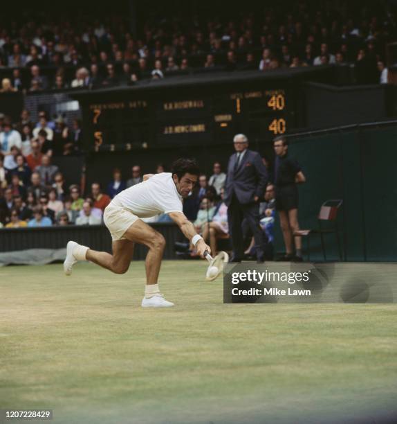 Australian professional tennis player Ken Rosewall in action against fellow Australian John Newcombe in the Men's Singles final of the 1970 Wimbledon...