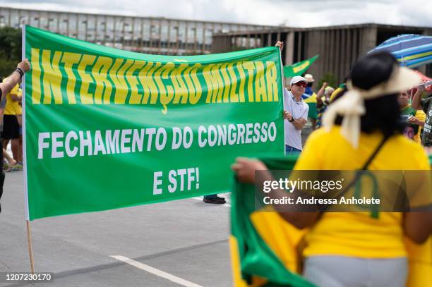 People participate in a motorcade demonstration in favor Brazilian President Jair Bolsonaro amidst the outbreak of the coronavirus in the Esplanada...