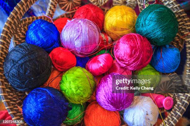 balls of threads for traditional bhutanese weaving and embroidery - thimphu stock pictures, royalty-free photos & images