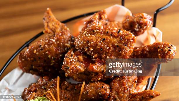 dakgangjeong korean fried chicken - korean fried chicken stock pictures, royalty-free photos & images