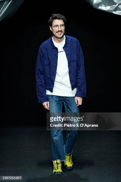 Fashion designer Marco Rambaldi acknowledges the applause of the audience during the Marco Rambaldi fashion show as part of Milan Fashion Week...