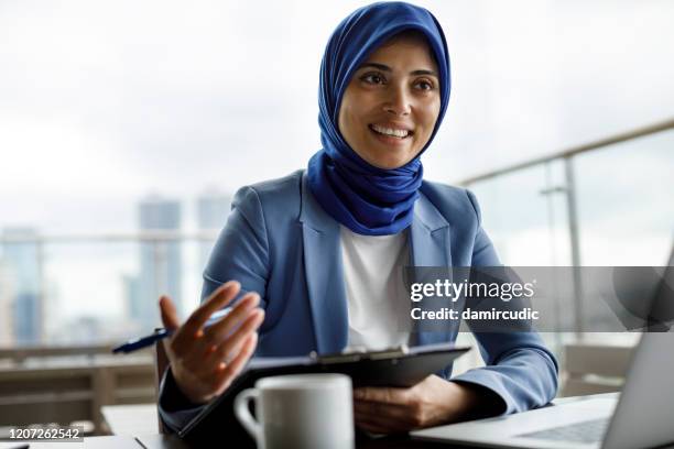 business meeting - middle eastern woman stock pictures, royalty-free photos & images