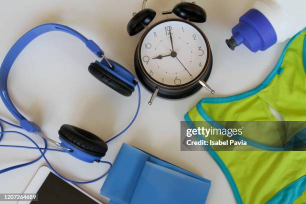 sports equipment and clock. sports time concept - punching clock stock pictures, royalty-free photos & images