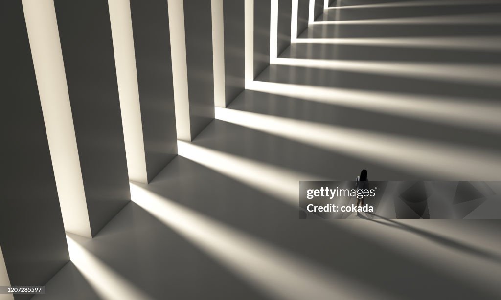 High angle of a young woman walking on corridor