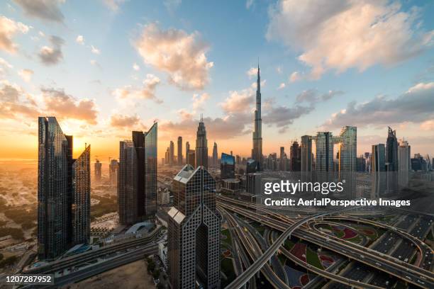 high angle view of dubai skyline at sunrise - arial view dubai skyline stock pictures, royalty-free photos & images