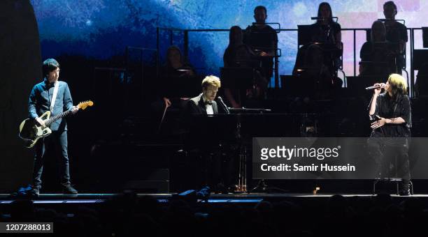 Billie Eilish , Finneas O'Connell and Johnny Marr perform during The BRIT Awards 2020 at The O2 Arena on February 18, 2020 in London, England.