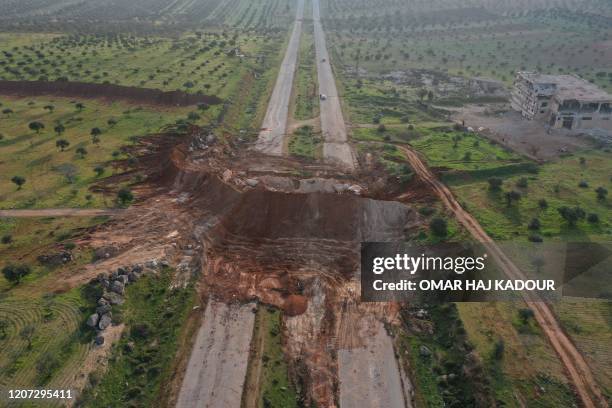 Drone image taken on March 16 shows a blocked section of the M4 highway, which links the northern Syrian provinces of Aleppo and Latakia.