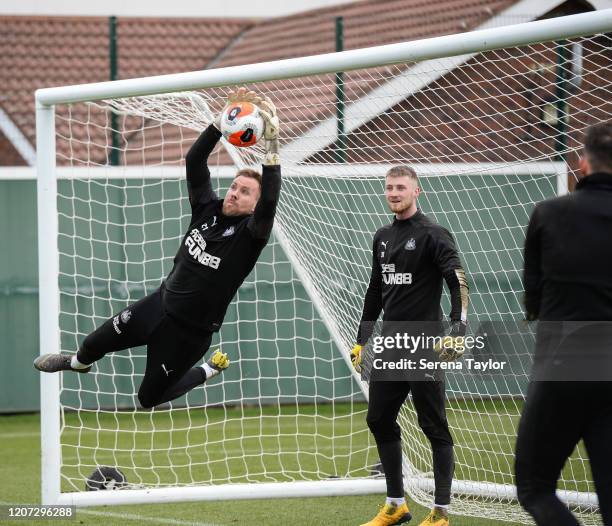 Goalkeeper Rob Elliot jumps high to catch the ball during the Newcastle United Training Session at the Newcastle United Training Centre on February...