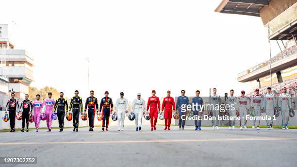 The F1 drivers for the 2020 season walk down the track during day one of Formula 1 Winter Testing at Circuit de Barcelona-Catalunya on February 19,...