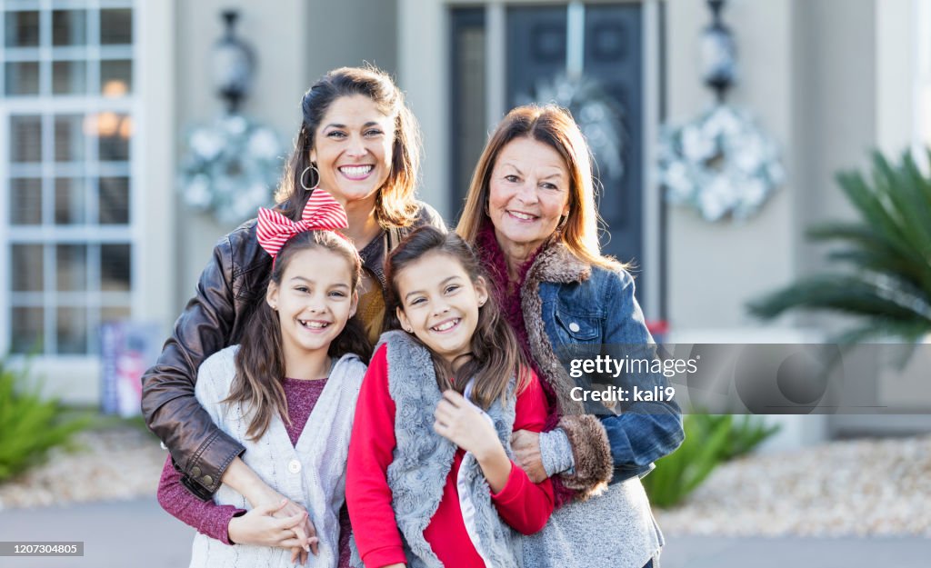 Twin girls with mother and grandmother