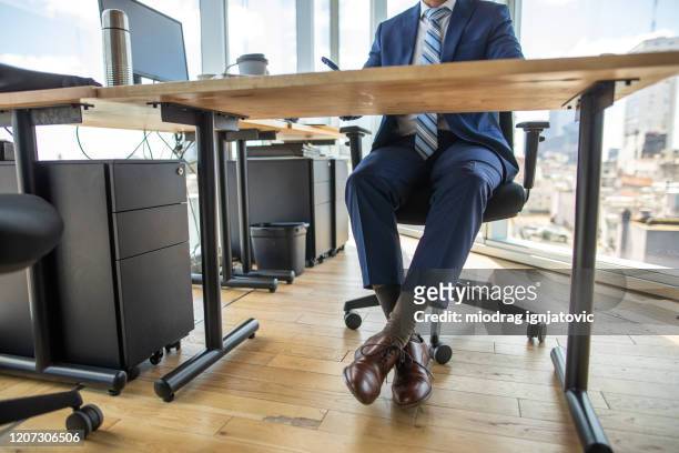 low section of formal dressed businessman in office - formal office stock pictures, royalty-free photos & images