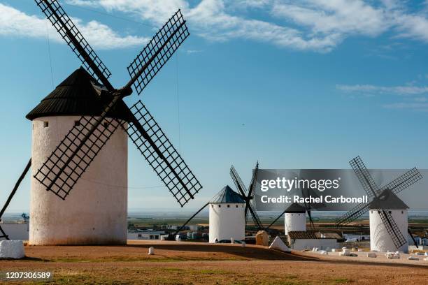 cervantes's don quixote restored spanish windmills. - campo de criptana stock pictures, royalty-free photos & images
