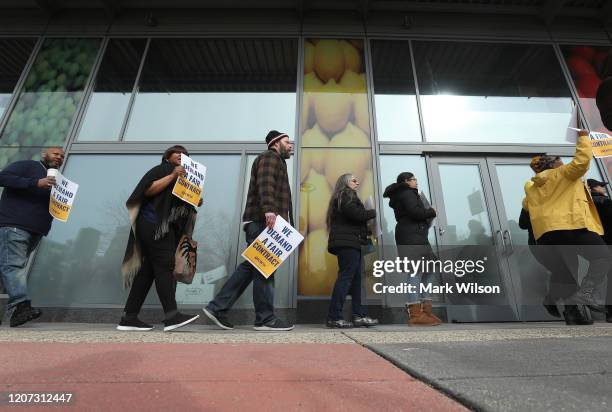 Giant and Safeway grocery store workers protest in front of a Safeway Store for fair union contract negotiations on February 19, 2020 in Washington,...