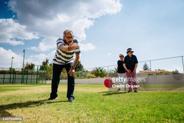 healthy senior people playing boules - petanque stock pictures, royalty-free photos & images