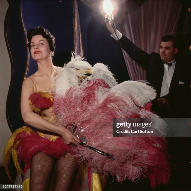 Showgirl Lee Vernon at the Pigalle Club nightclub in London. Original Publication: Picture Post - 6556 - Night Club Close-Up - pub. 1953