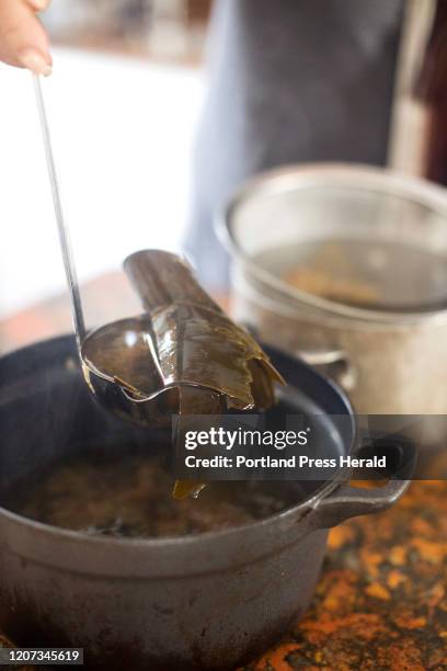 Christine Burns Rudalevige ladles the kombu out of the first dashi broth and miso soup on Wednesday, Feb. 12, 2020.