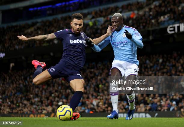 Ryan Fredericks of West Ham United and Benjamin Mendy of Manchester City during the Premier League match between Manchester City and West Ham United...