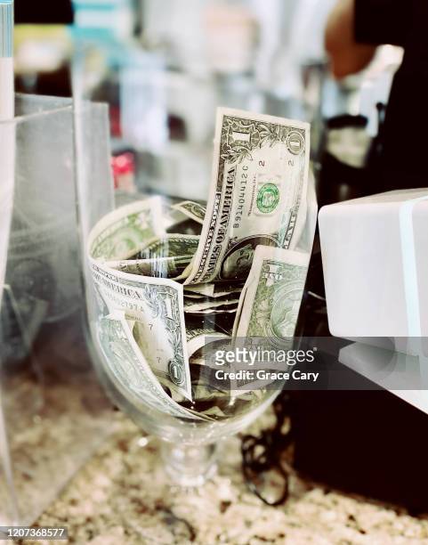 close-up of tip jar on restaurant counter - tip jar stock pictures, royalty-free photos & images