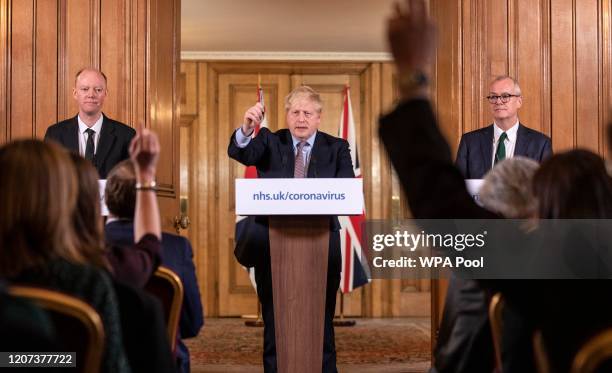 Prime Minister Boris Johnson gives a press conference on the ongoing situation with the coronavirus pandemic with chief medical officer Chris Whitty...