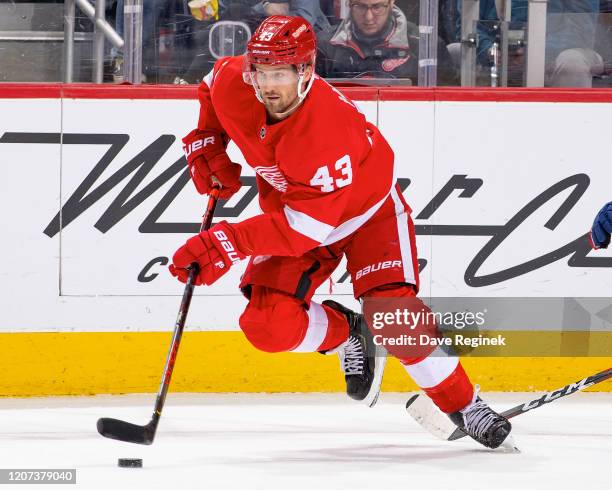 Darren Helm of the Detroit Red Wings skates up ice with the puck against the Montreal Canadiens during an NHL game at Little Caesars Arena on...