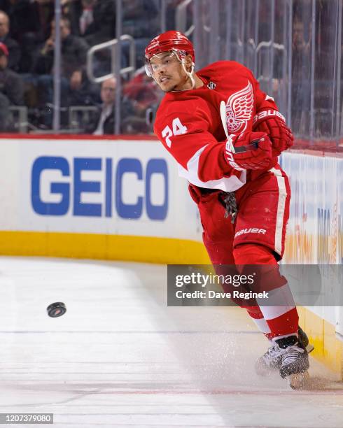 Madison Bowey of the Detroit Red Wings shoots the puck against the Montreal Canadiens during an NHL game at Little Caesars Arena on February 18, 2020...