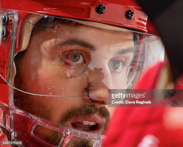 Brendan Perlini of the Detroit Red Wings watches the action from the bench against the Montreal Canadiens during an NHL game at Little Caesars Arena...