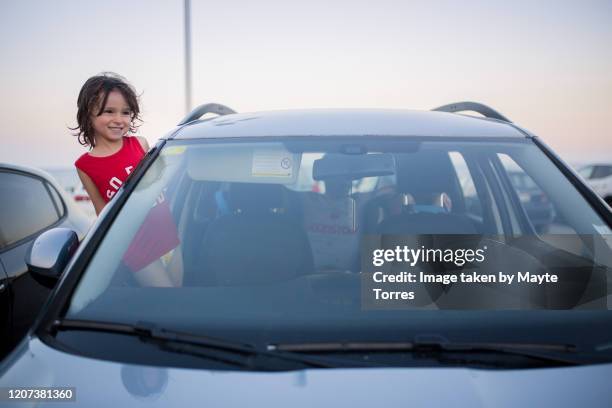 boy standing with half body out of the window - hot boy body stock pictures, royalty-free photos & images