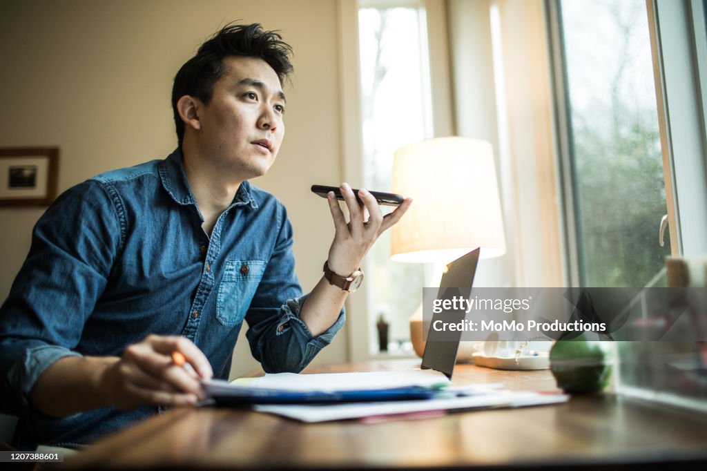 Man (early 30s) working in home office