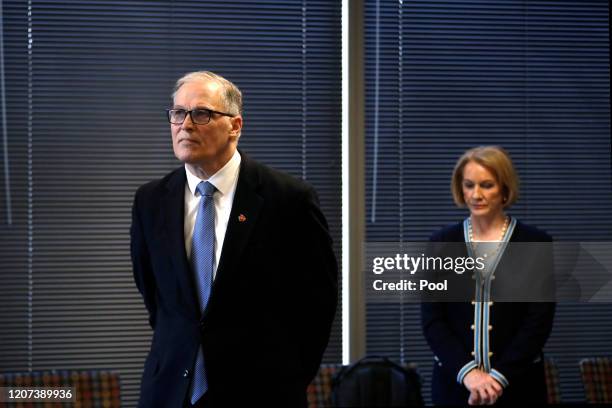 Washington Gov. Jay Inslee, left, and Seattle Mayor Jenny Durkan keep a social distance at a news conference about the coronavirus outbreak Monday,...