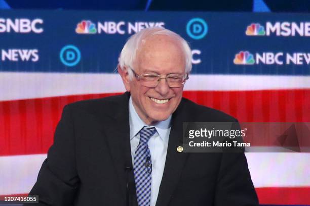 Democratic presidential candidate Sen. Bernie Sanders smiles during the Democratic presidential primary debate at Paris Las Vegas on February 19,...