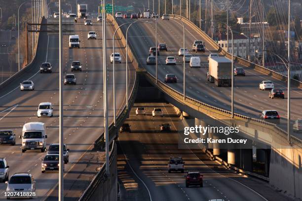 Rush hour traffic is lighter than normal during the morning commute heading in and out of Seattle on Interstate 5 on March 16, 2020 in Seattle,...